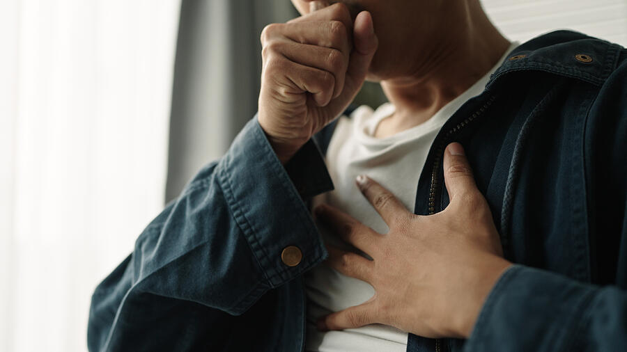 Man was suffering from painful chest pain from a chronic disease. Photograph by Pocketlight Man was suffering from painful chest pain from a chronic disease. Photograph by Pocketlight