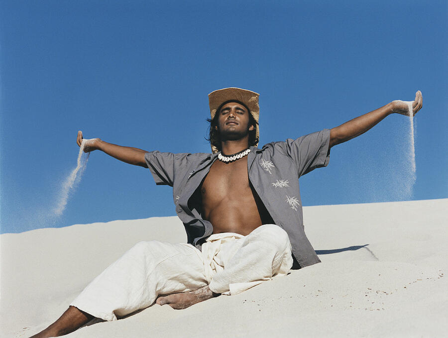 Man Wearing a Straw Hat Sits in the Sand With His Arms Out and Eyes Closed Photograph by BJ Formento