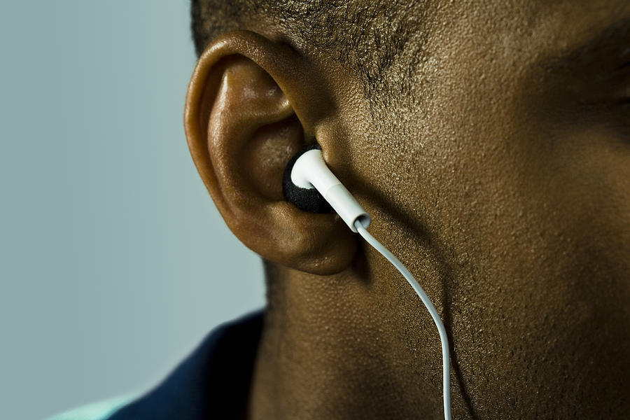 Man Wearing Ear Buds Photograph by Fuse