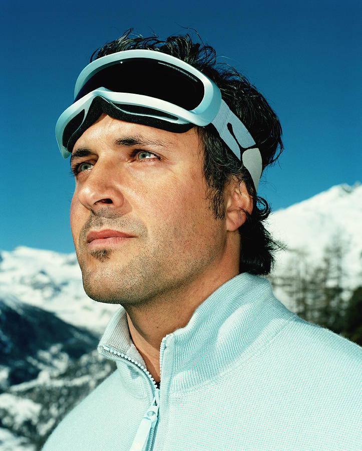 Man wearing ski goggles outdoors, close-up Photograph by Tim Macpherson