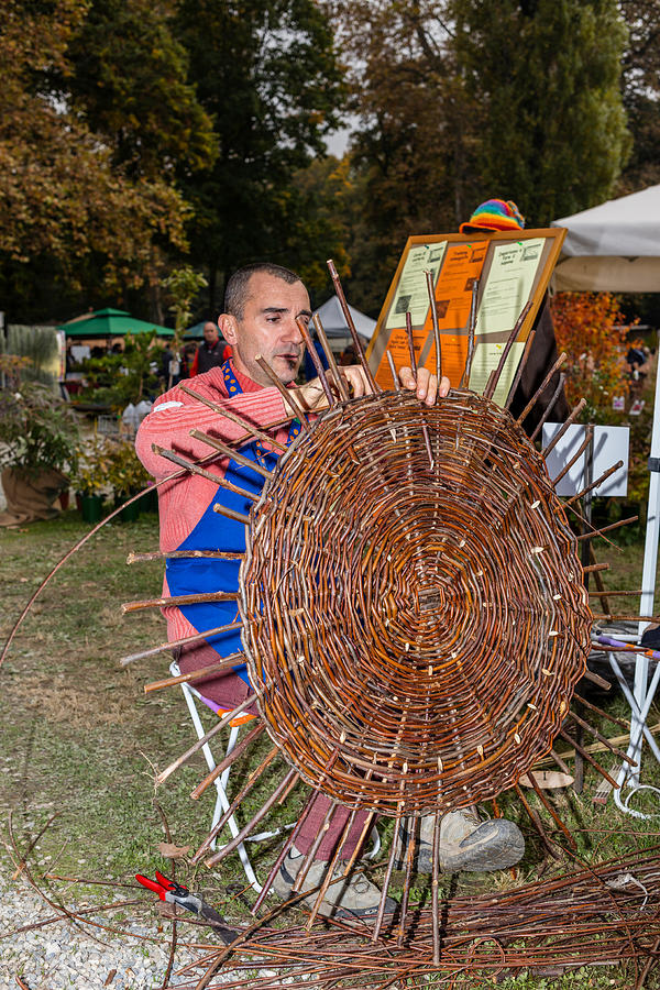 Man weaving a wicker basket Photograph by MicheleVacchiano