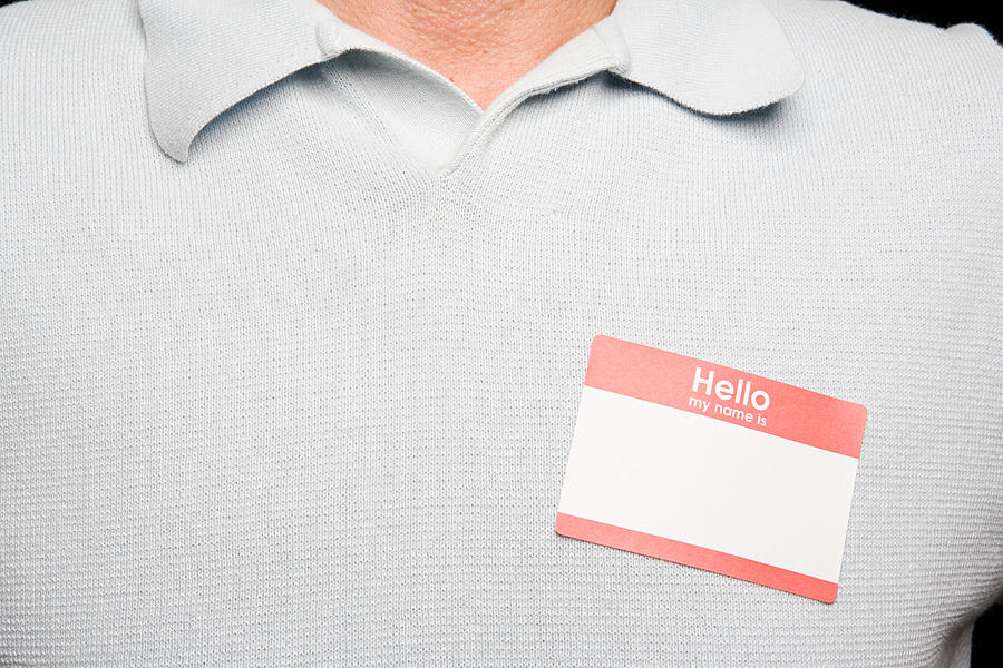 Man with blank name tag Photograph by Image Source