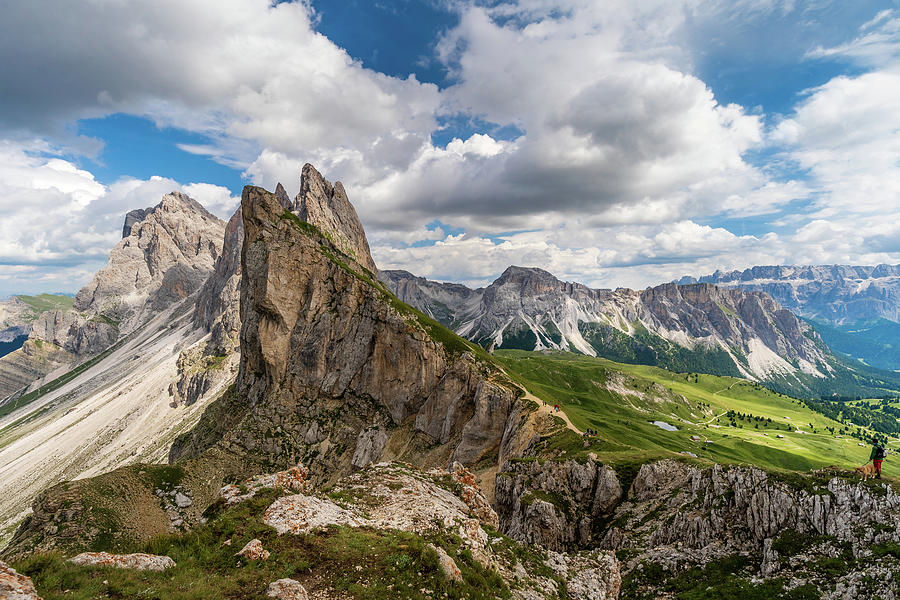 Man with dog is looking the most beautiful peak of Seceda at the ...