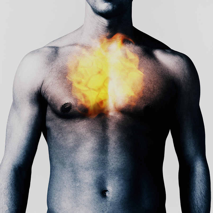 Man with fireball over chest, mid section Photograph by Adam Gault