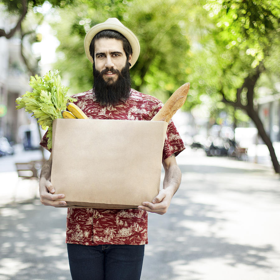 Man with grocery bag Photograph by Orbon Alija