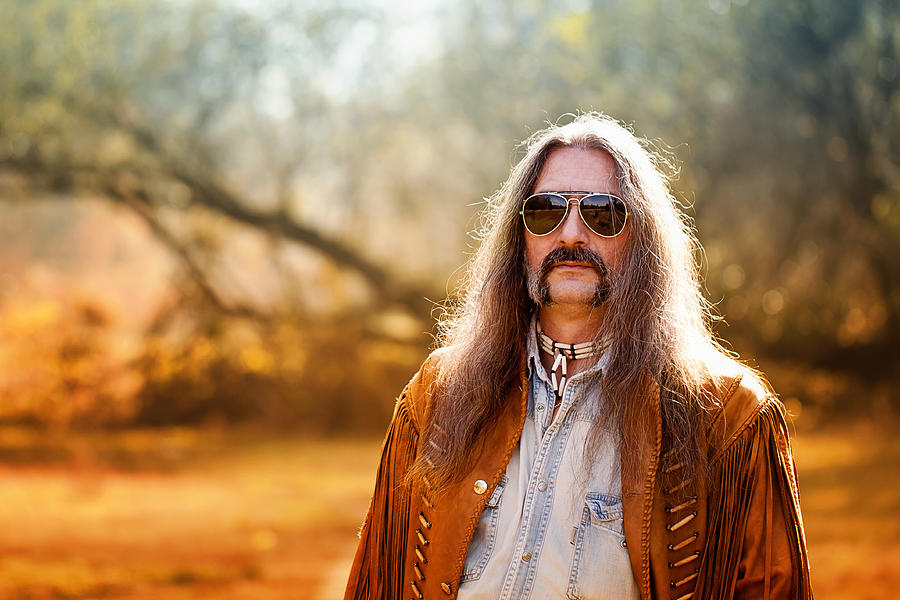 Man with long hair and sunglasses Photograph by Daniela Solomon