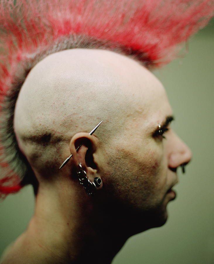 Man with mohawk and piercings, profile, close up Photograph by Tipp Howell
