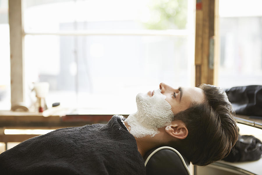 Man With Shaving Foam At Barber Shop Photograph by Tara Moore