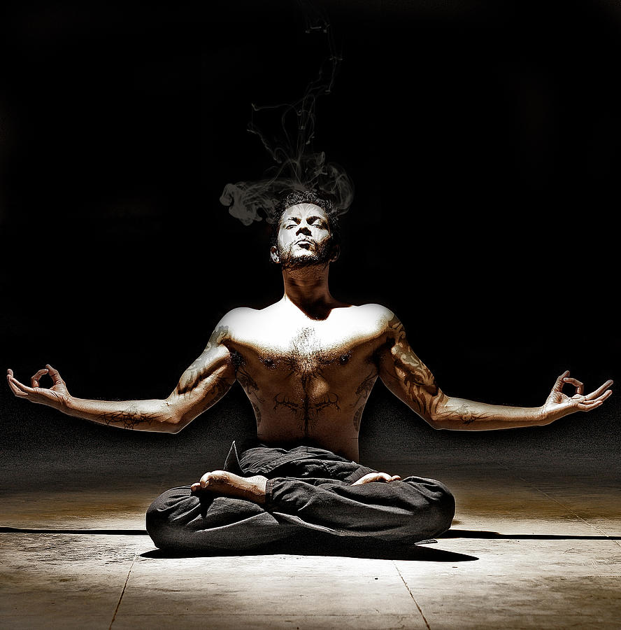 Man with Tattoos Meditating in Yoga Posture Photograph by Vramak