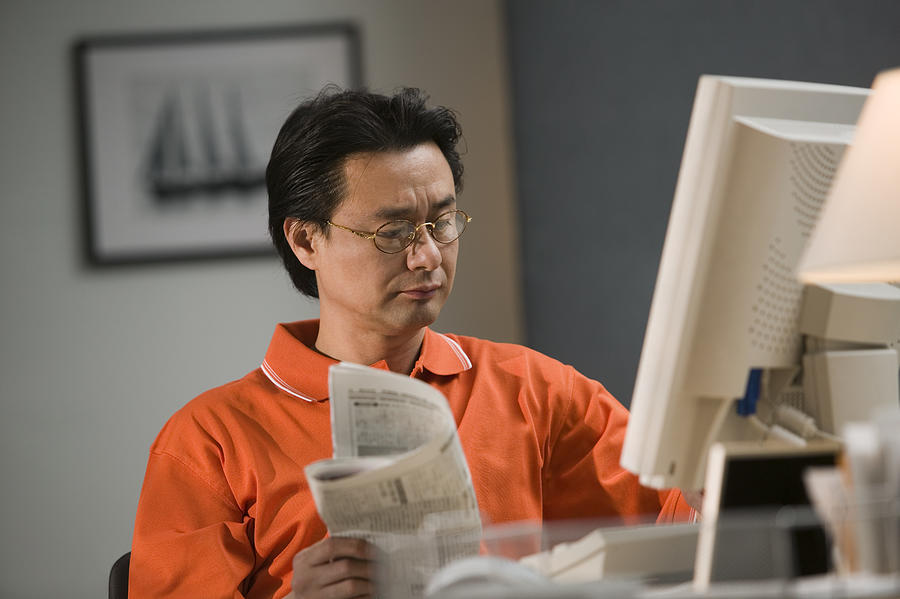 Man working in home office Photograph by Comstock Images