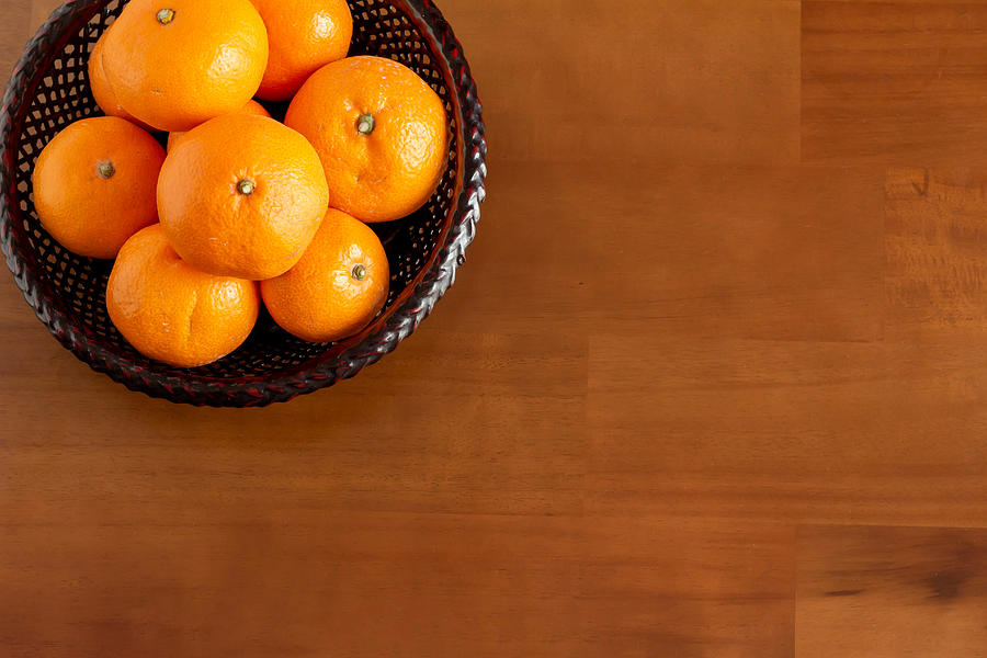 Mandarin oranges placed on the kotatsu Photograph by C11yg
