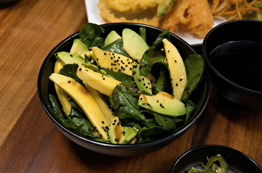 Mango, avocado and baby spinach salad with black sesame seeds Photograph by Simon McGill