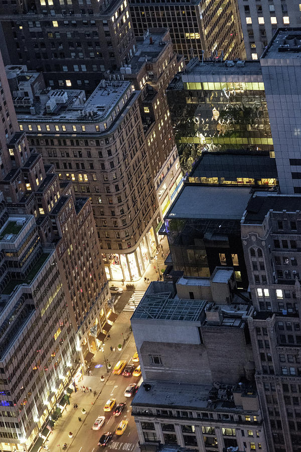Manhattan street at night Photograph by Alberto Zanoni