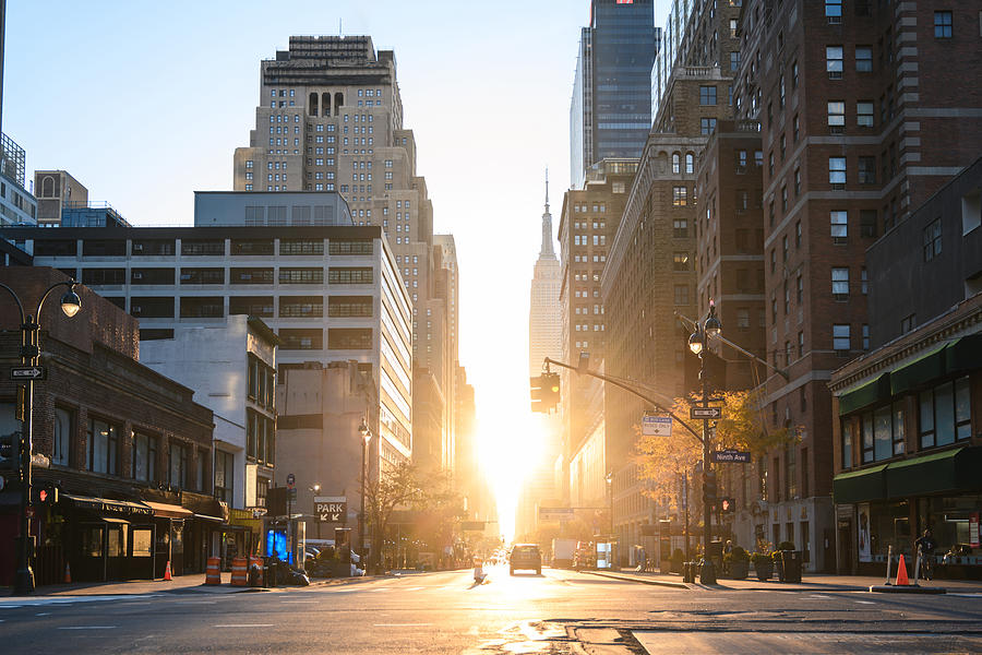 Manhattan streets at sunrise, New York City Photograph by © Marco Bottigelli