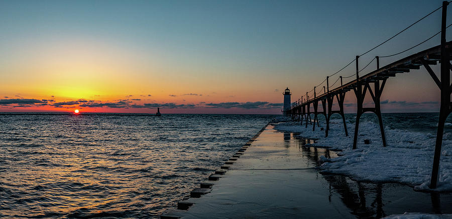 Manistee Pier and Lighthouse at Sunset in Michigan during winter Photograph by Eldon McGraw