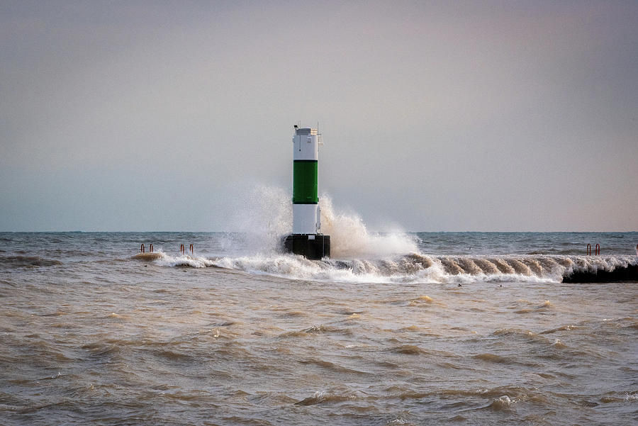 Manitowoc Pierhead Light, the Waves, and the Sun Photograph by Janice Adomeit