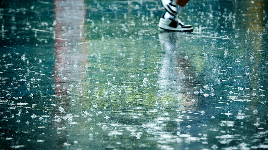 Mans Feet in the Rain Photograph by Harmatoslabu