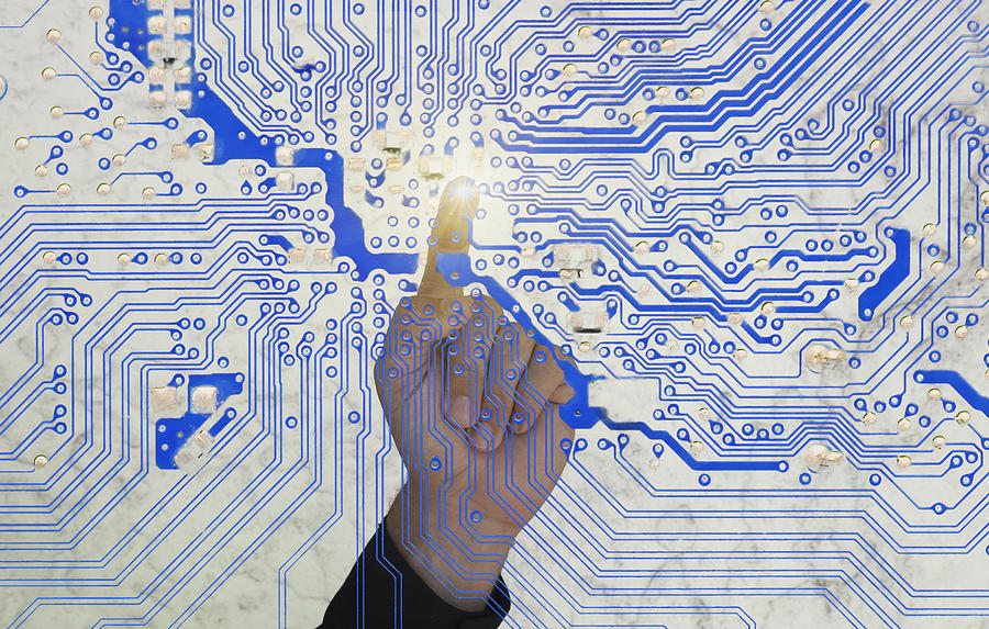 Mans Finger Pointing A Circuit Board Photograph by Buena Vista Images