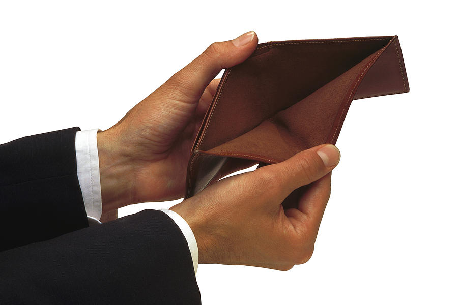 Mans hands holding empty wallet Photograph by Comstock