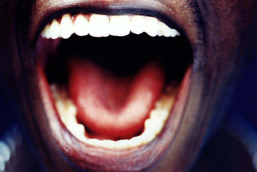 Mans open mouth, close-up Photograph by Leland Bobbe