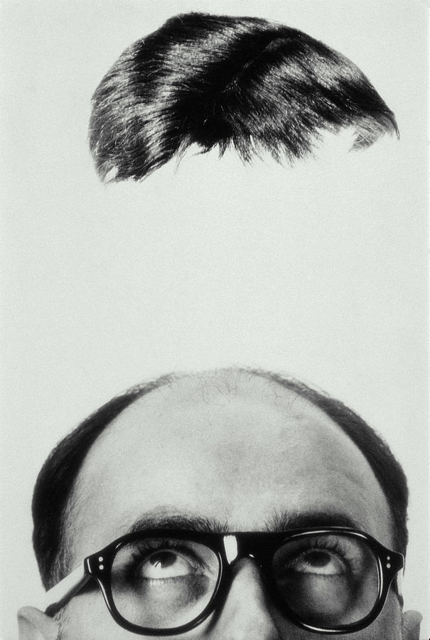 Mans Toupee Hovering Overhead, 1965 Photograph by Archive Holdings Inc.