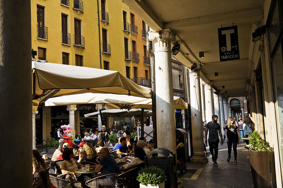 Mantua: portici with people who park between shops and bars Photograph by LuigiConsiglio