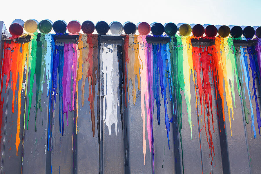 Many colours splash dripping and spilling for wall background Photograph by Twinsterphoto