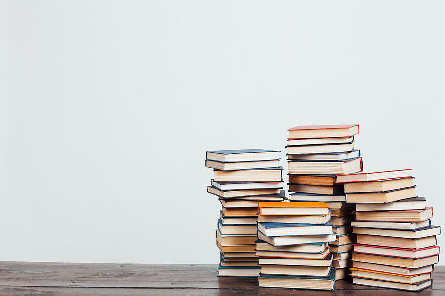 Many Stacks Of Educational Books At Home Preparing For Exams On A White Background Photograph by DmitriiSimakov