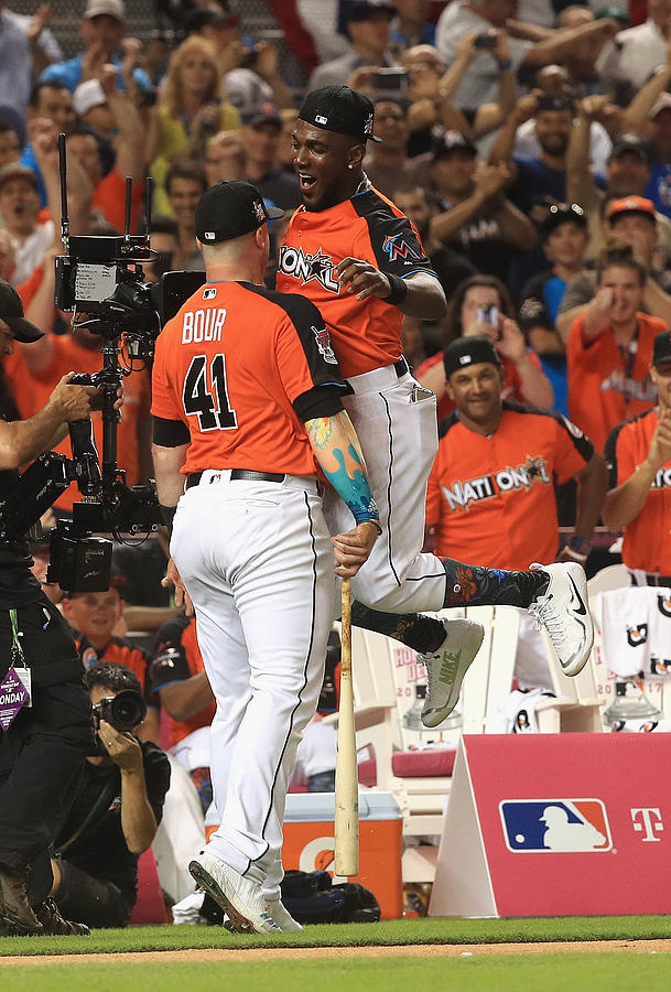 Marcell Ozuna and Justin Bour Photograph by Mike Ehrmann