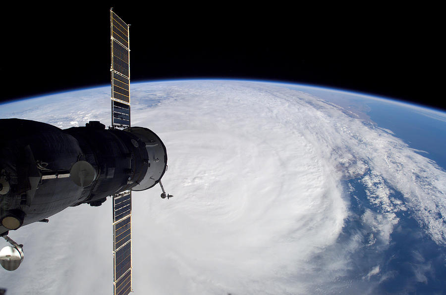 March 30, 2006 - Cyclone Glenda and a docked Soyuz spacecraft. Photograph by Stocktrek Images