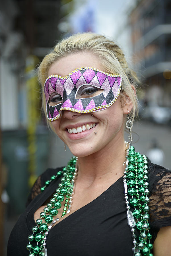 Mardi Gras girl with green beads and carnival mask Photograph by Joel Carillet