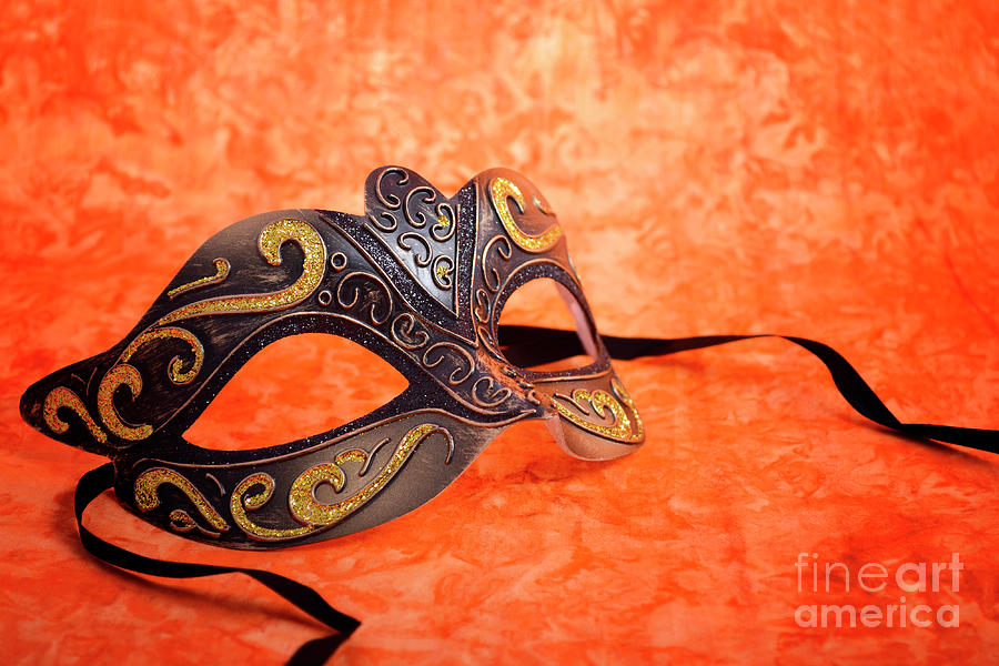 Mardi Gras mask on orange background.  Photograph by Milleflore Images