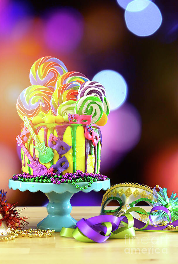Mardi Gras theme on-trend candyland fantasy drip cake. Photograph by Milleflore Images