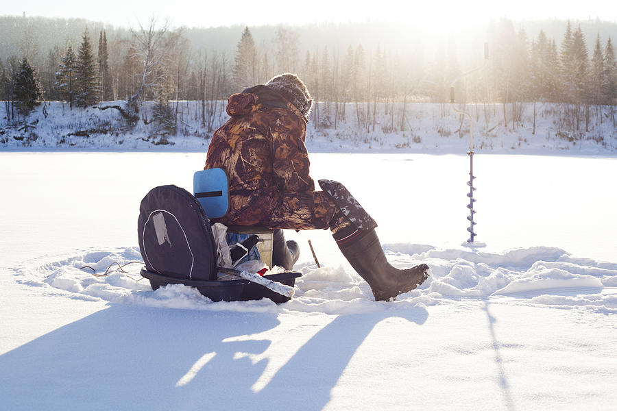 Mari man ice fishing in snowy field Photograph by Aliyev Alexei Sergeevich