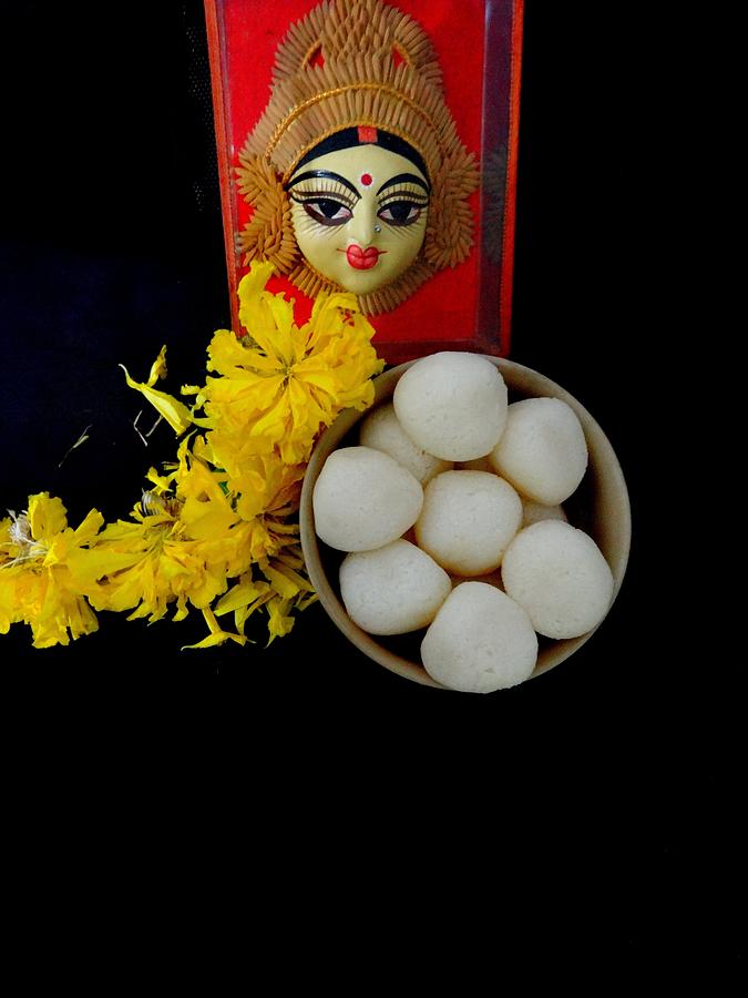 Marigold flowers and rasgulla offered to Goddess Photograph by Veena Nair