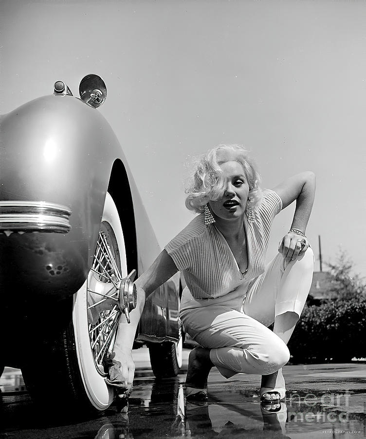 Marilyn Monroe with 1952 Jaguar XK120 Photograph by Retrographs