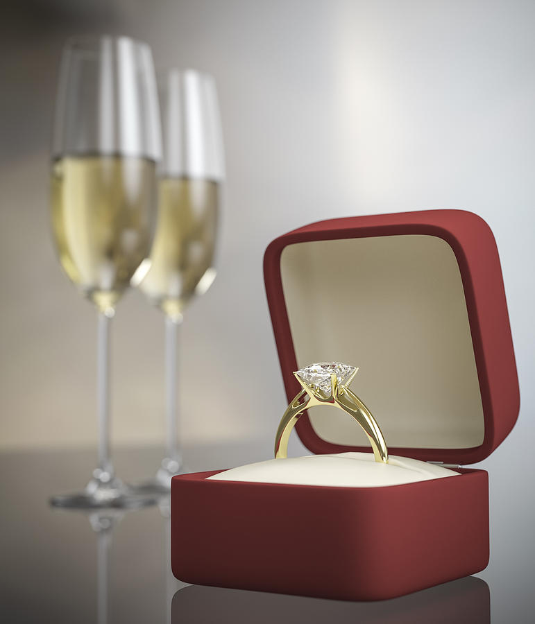 Marriage proposal concept with ring and two glasses of wine Photograph by Mevans