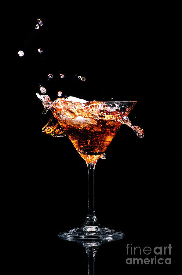 Martini Cocktail Splash On Black Background. Still Life. Photograph