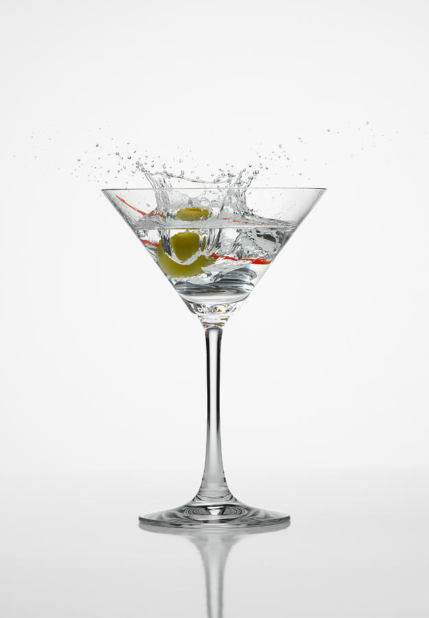 Martini splash white background Photograph by Don Farrall