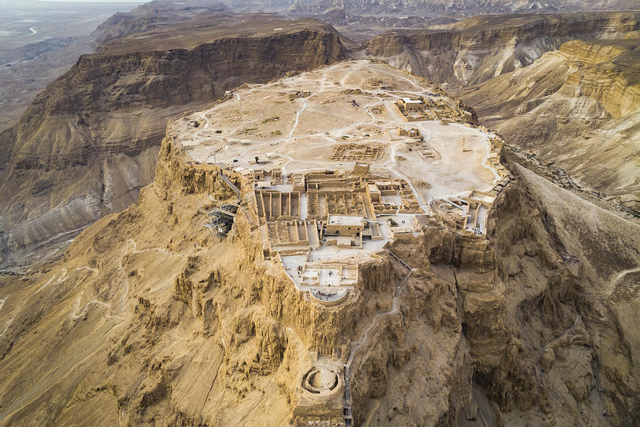 Masada fortress area Southern District of Israel Dead Sea area Southern District of Israel. Ancient Jewish fortress of the Roman Empire on top of a rock in the Judean desert, front view from the air Photograph by Diy13