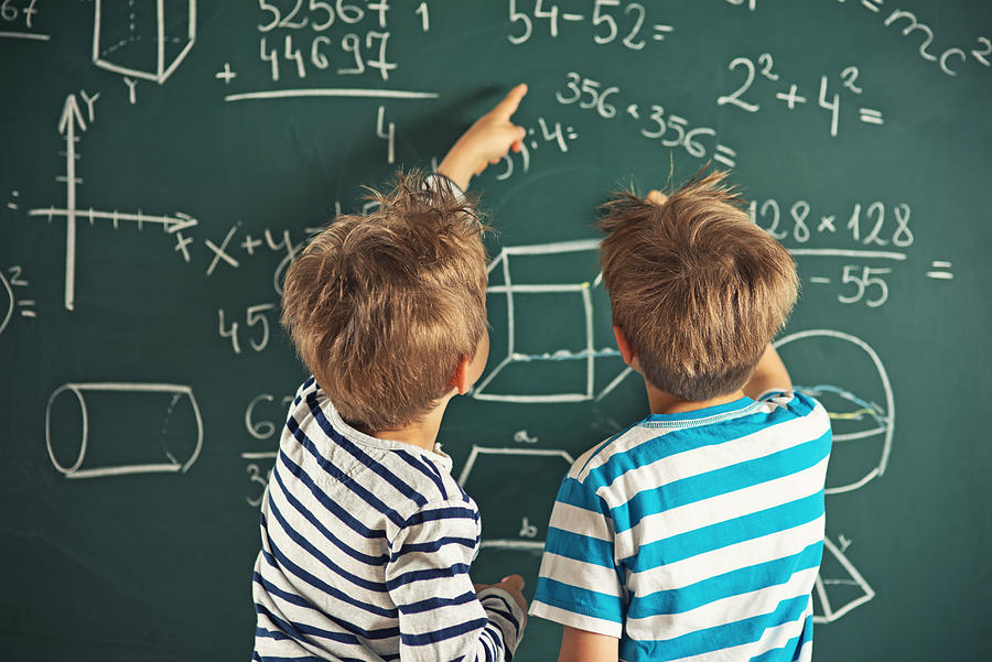 Math is fun - little boys solving mathematical problems Photograph by Imgorthand