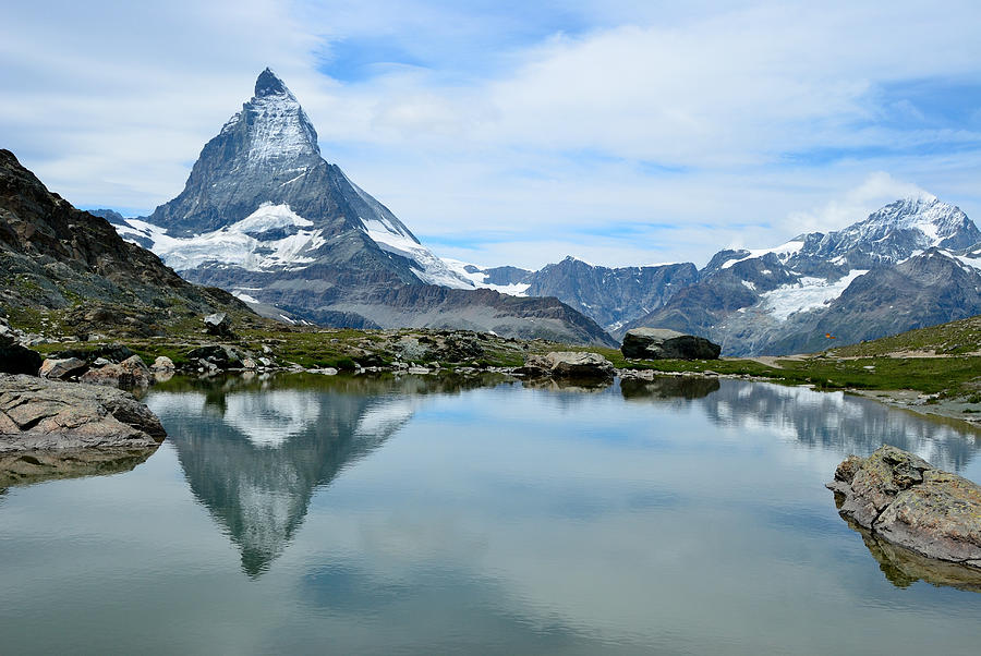 Matterhorn reflecting in lake Riffelsee Photograph by Werner Büchel