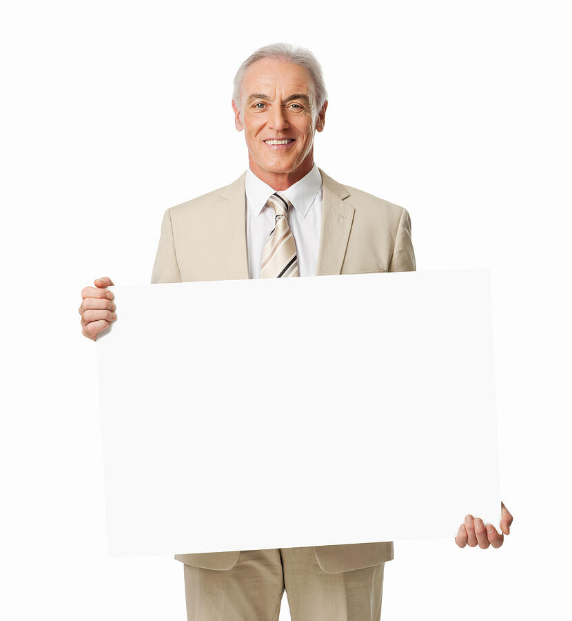 Mature Businessman Holding Blank Sign - Isolated Photograph by Neustockimages