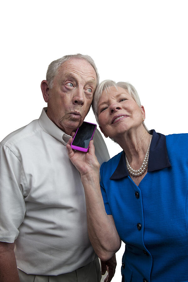 Mature Couple with Cell Phone Photograph by Kdorame