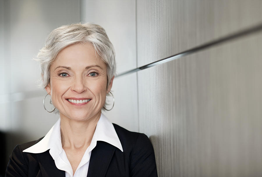Mature executive business woman smiling Photograph by Francisblack