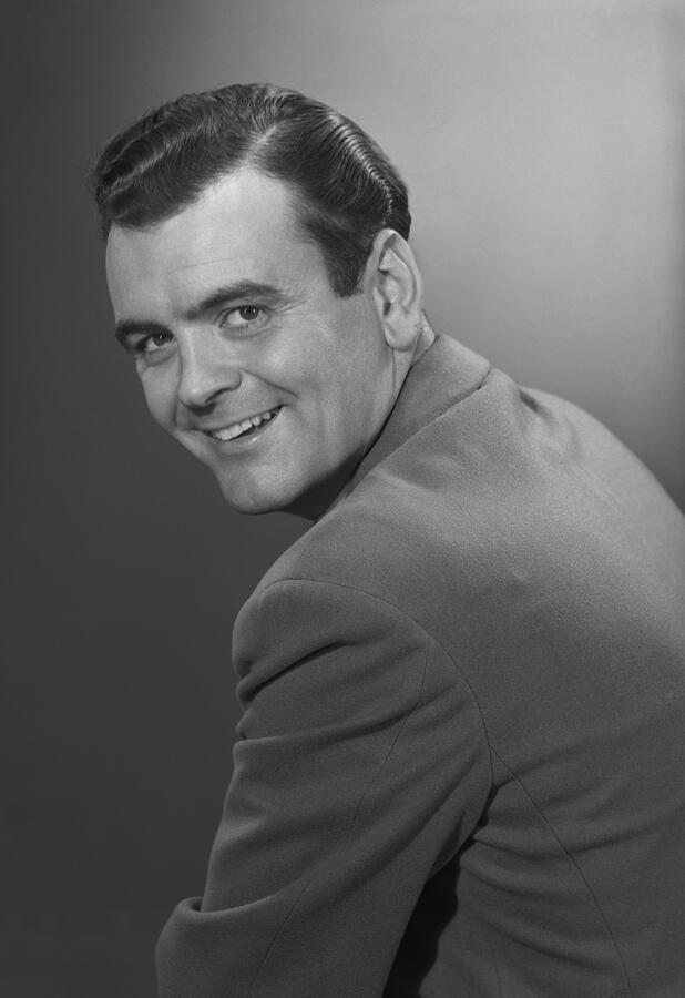 Mature man smiling, portrait Photograph by George Marks