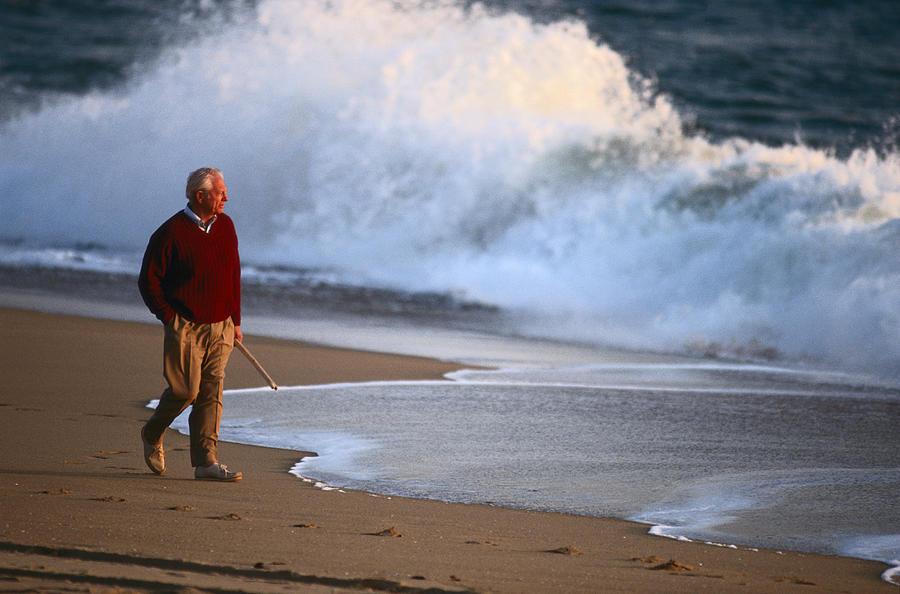 Mature Man Walking On Beach Photograph by Michael Salas