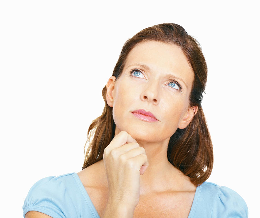 Mature woman, deep in thought Photograph by GlobalStock