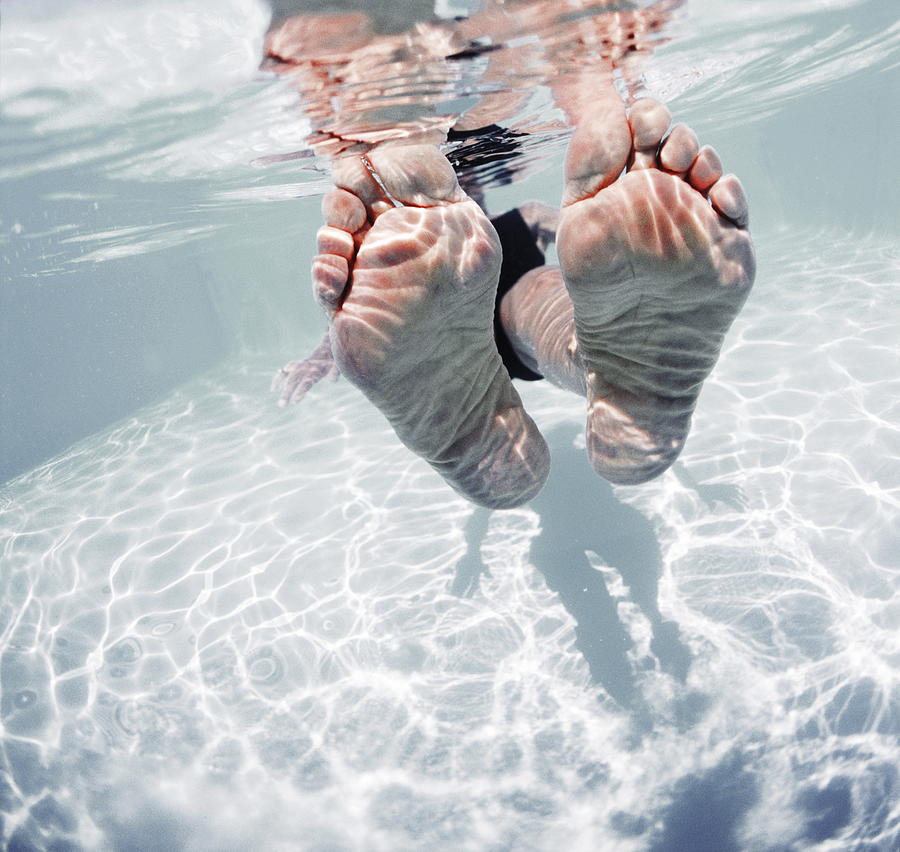 Mature Womans Feet In Pool, Close-up Photograph by Vital Pictures