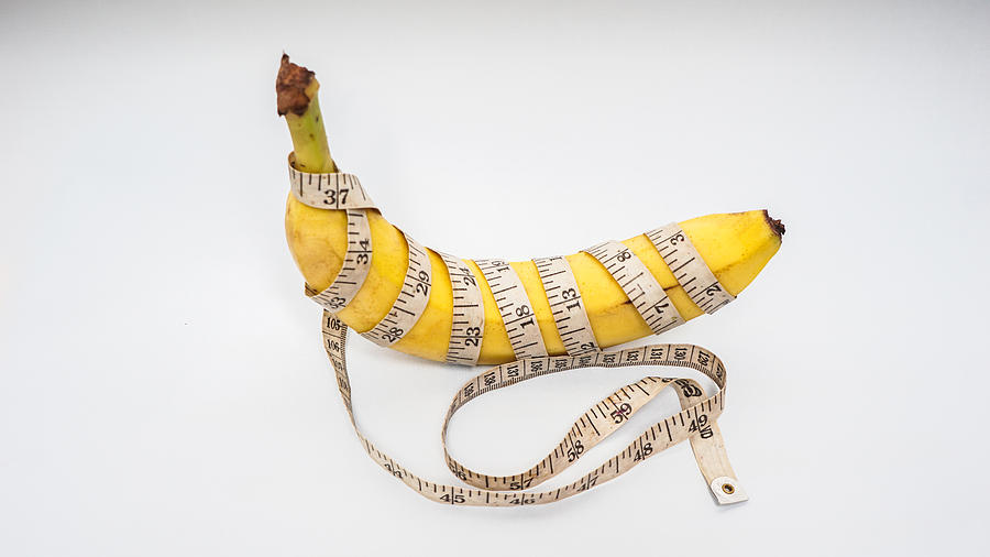 measure tape and banana Size matters Photograph by Fajrul Islam